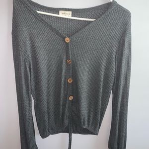 Grey button up sweater.